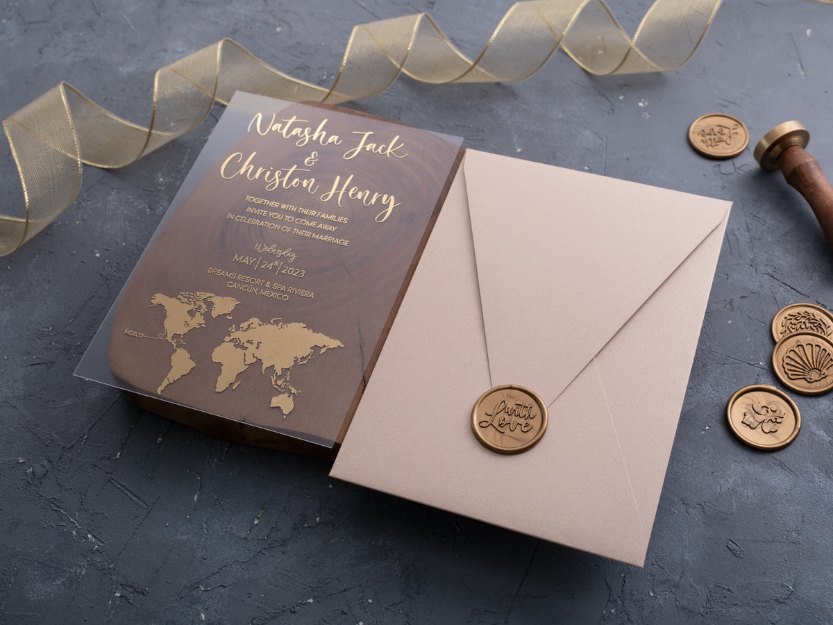 World map acrylic wedding invitation with gold foil and blush envelope