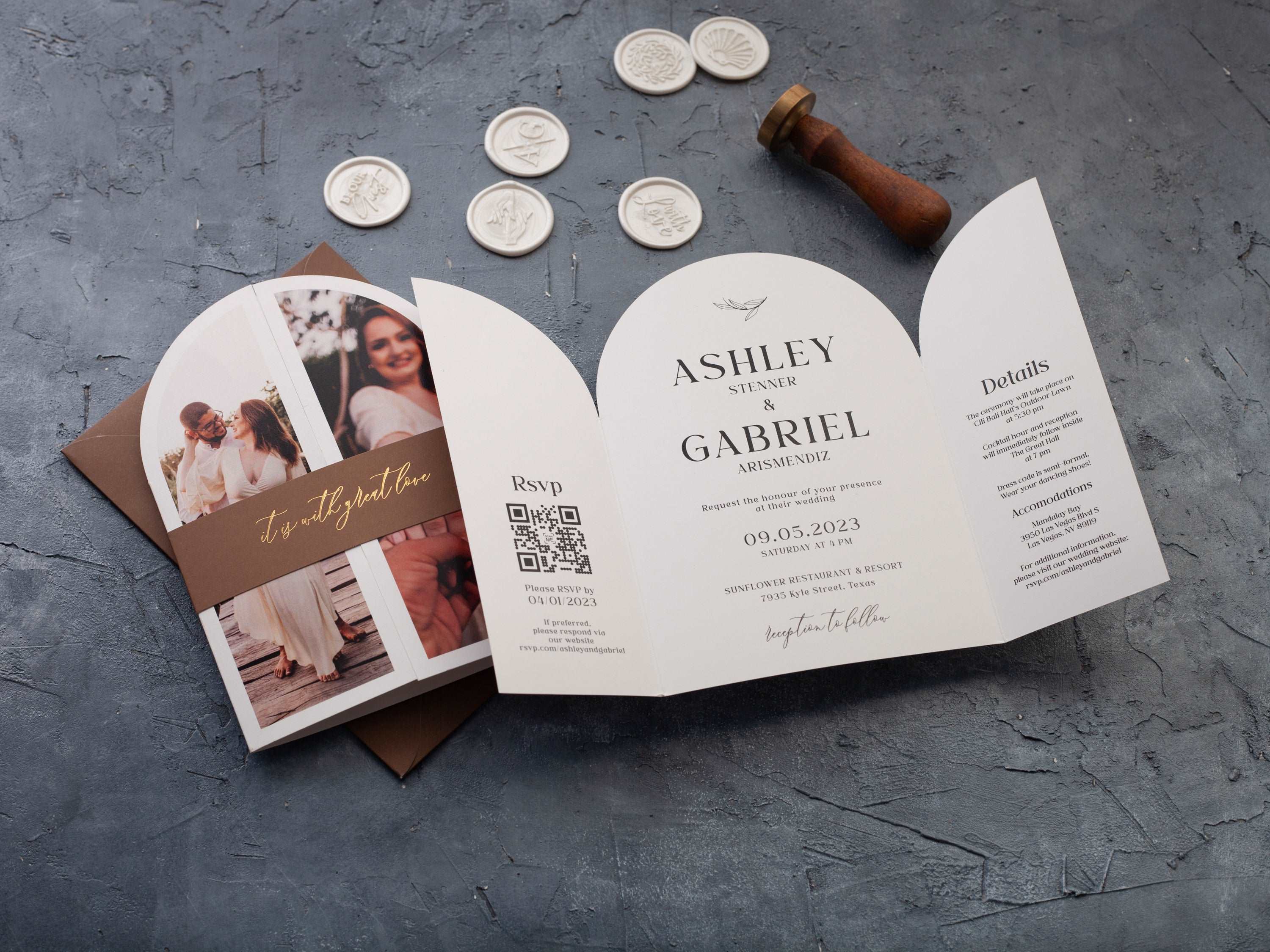 Open white gatefold wedding invitation showing a center panel and two side panels