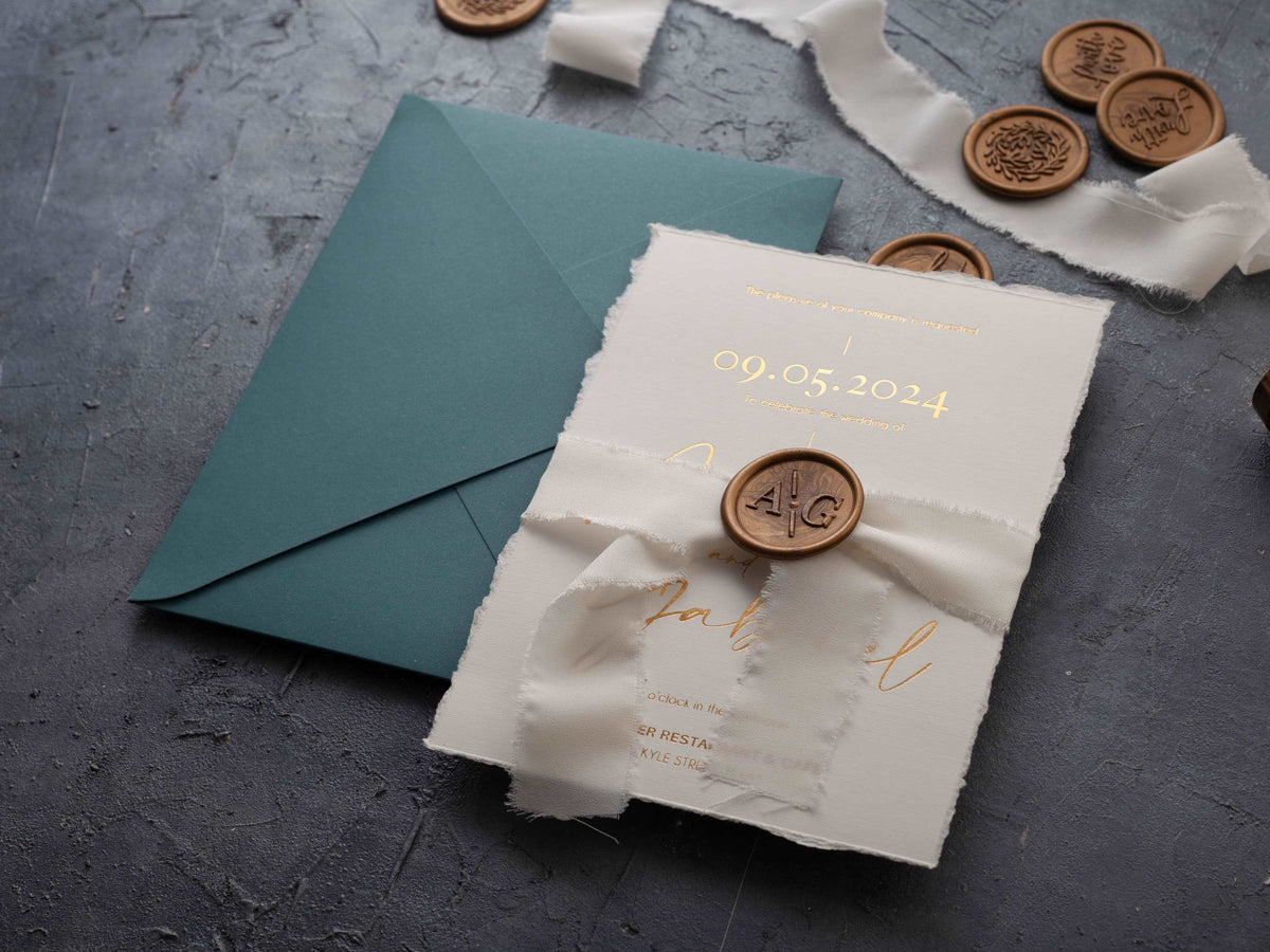 Deckled edge wedding invitation with gold foil lettering