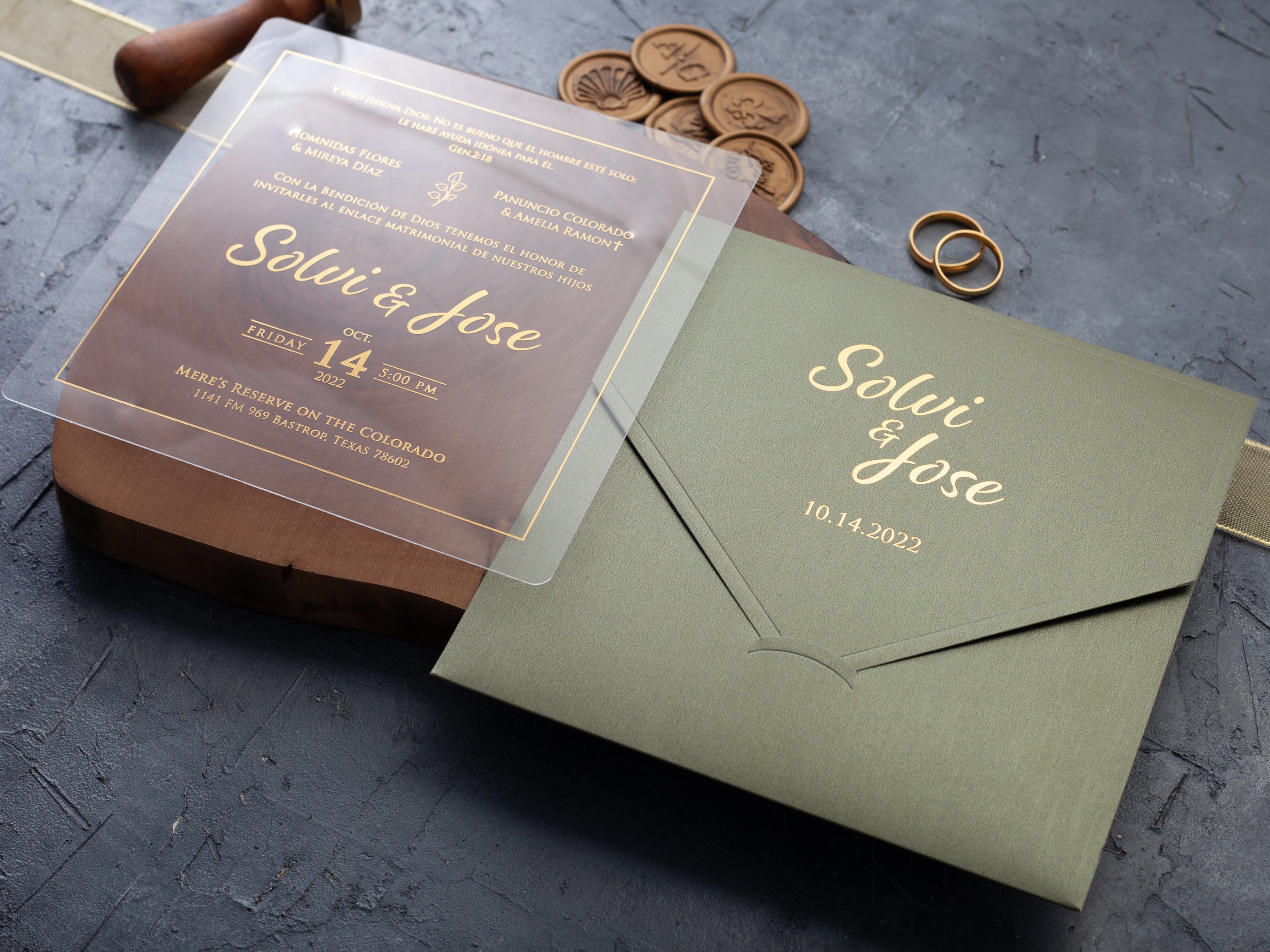 Clear acrylic wedding invitation with gold lettering and sage green envelope by World of Wedding Co.