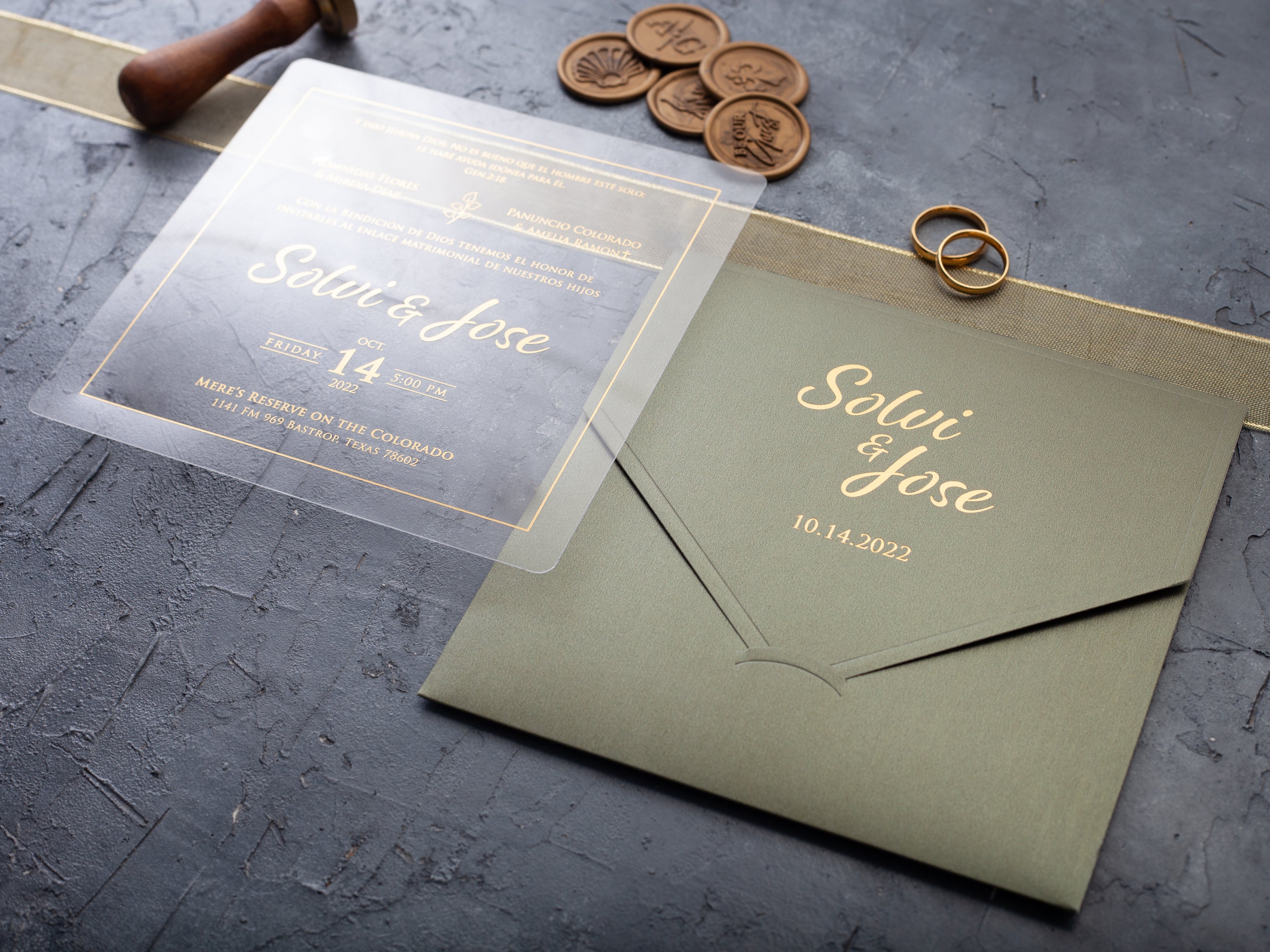 Clear acrylic wedding invitation with gold lettering and sage green envelope by World of Wedding Co.