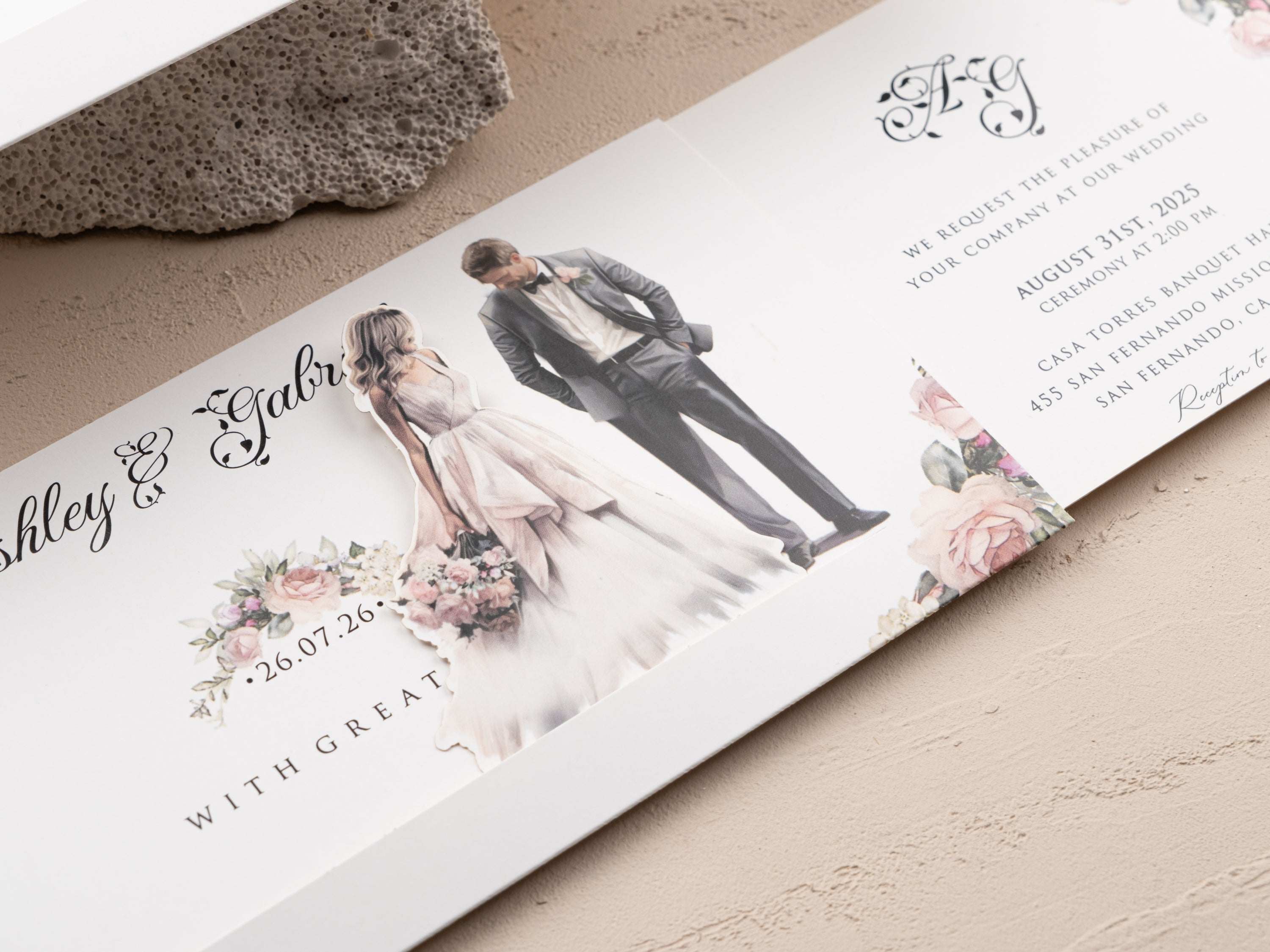 Elegant wedding invitation featuring hand-painted bride and groom with blush floral border and sliding reveal design.