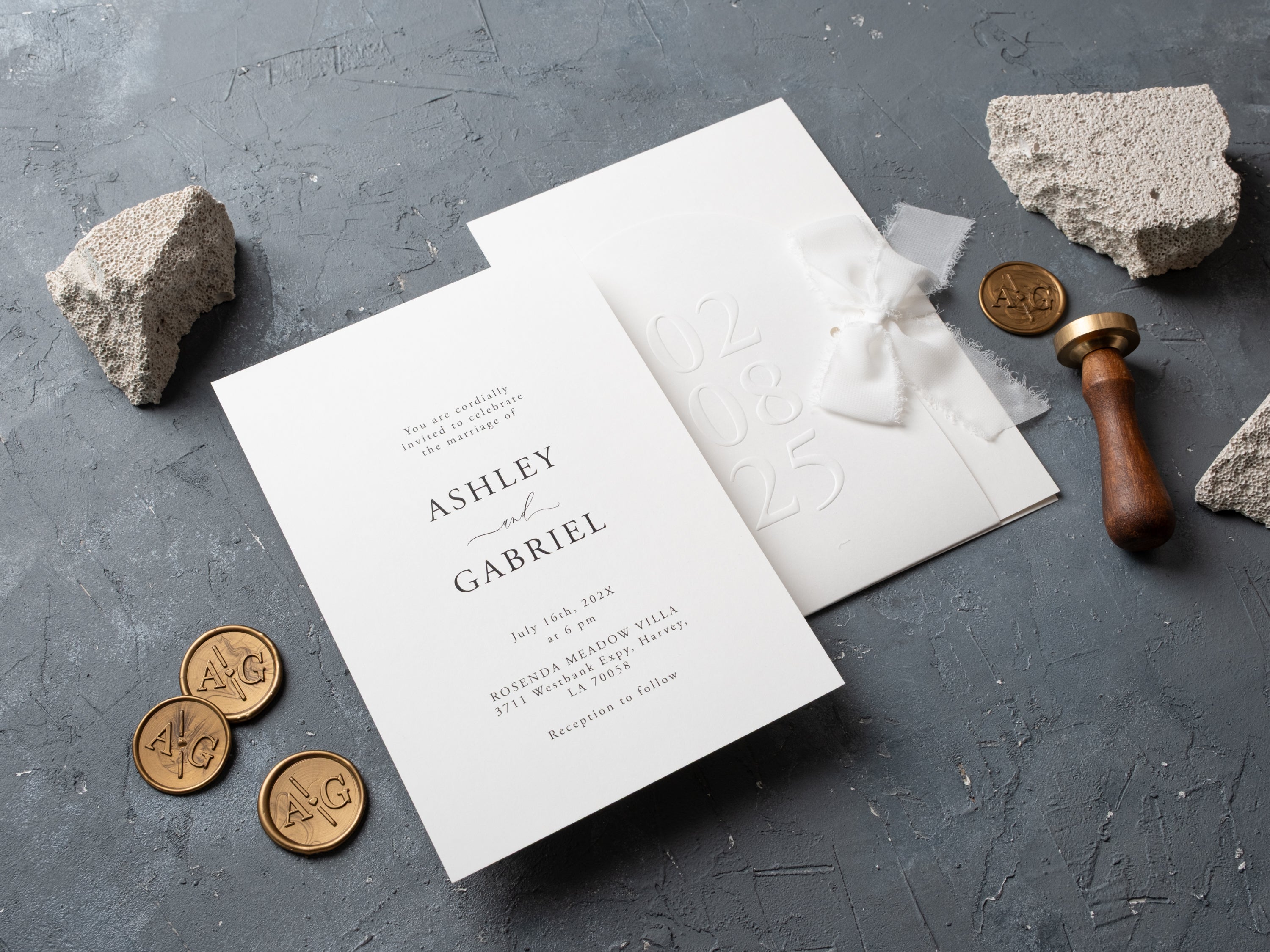 Custom wedding invites featuring embossed date and soft fabric bow