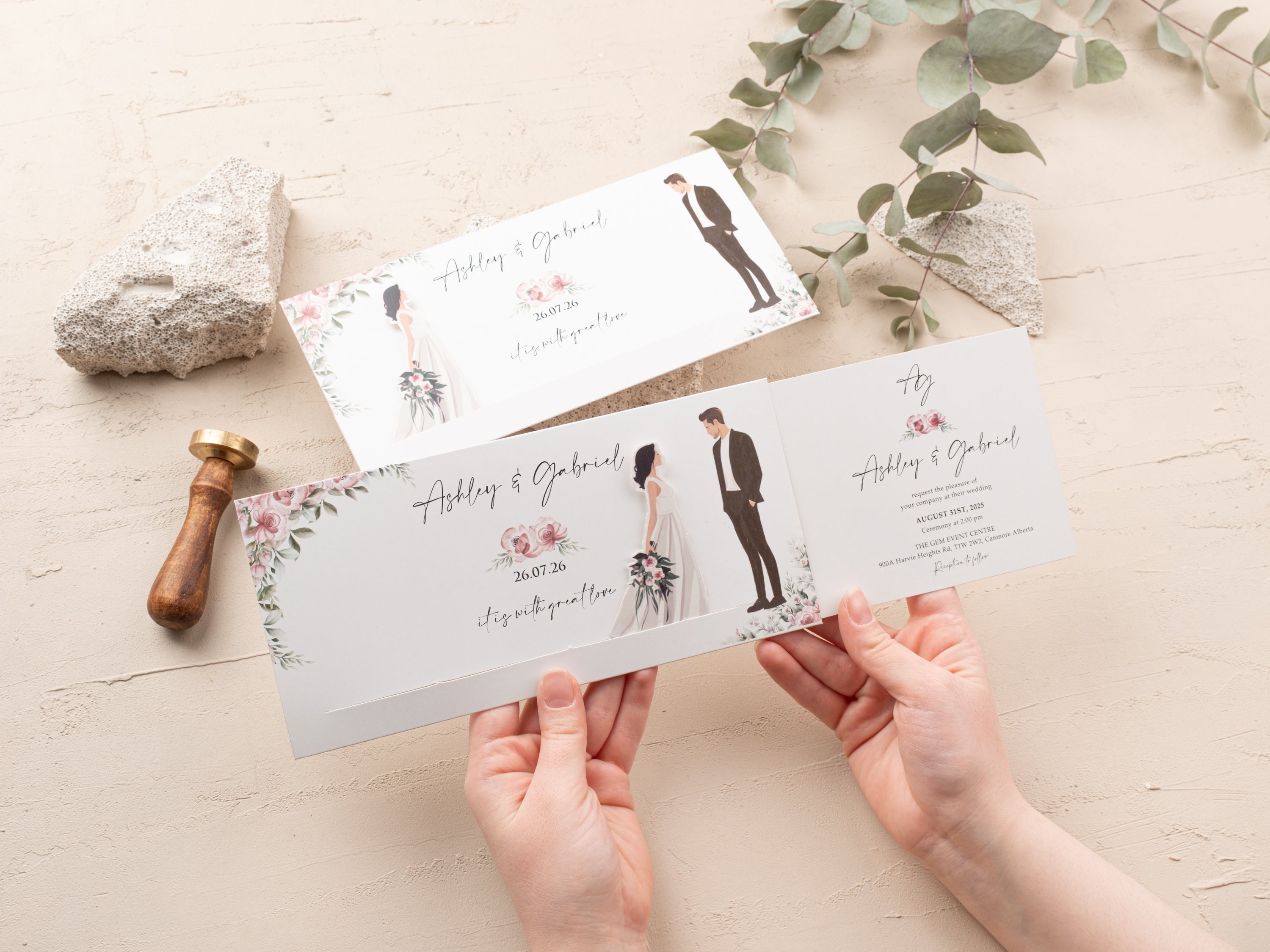 Person opening a modern blush floral sliding wedding invitation with minimalist design and personalized details.