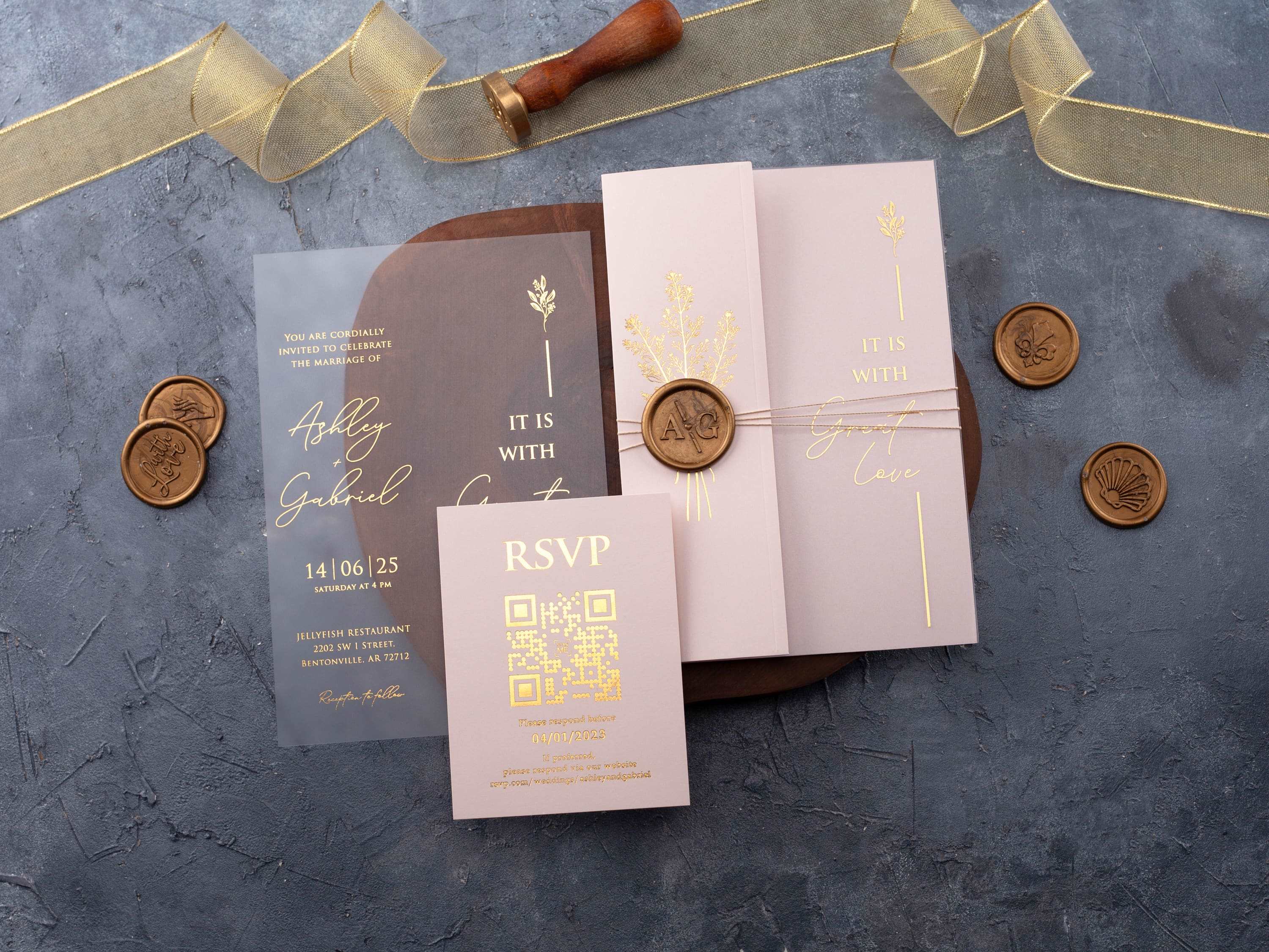 Blush pink folded wedding invitation with a clear acrylic card and gold foil details