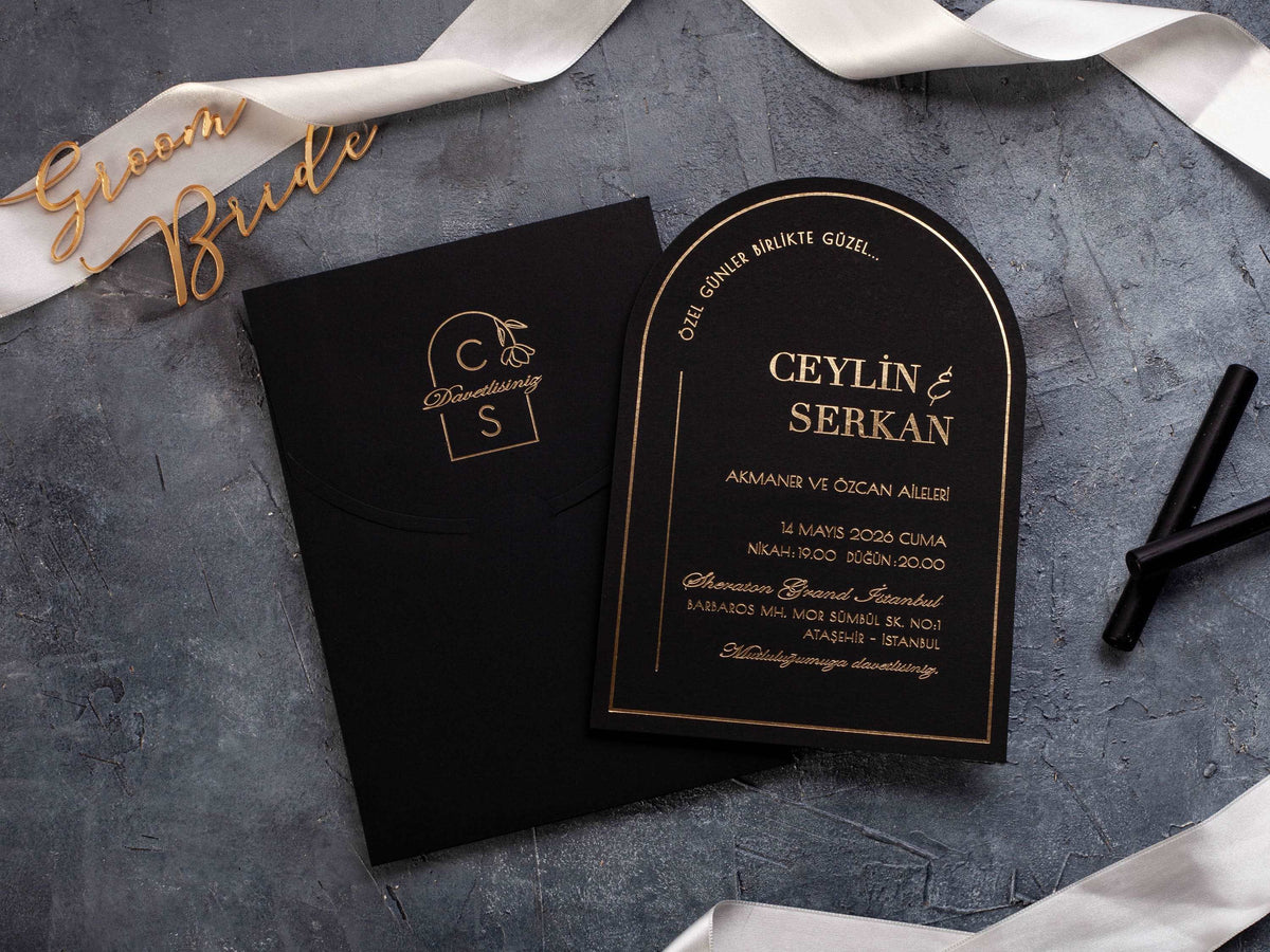 Black arch wedding invitation with crisp gold foil lettering