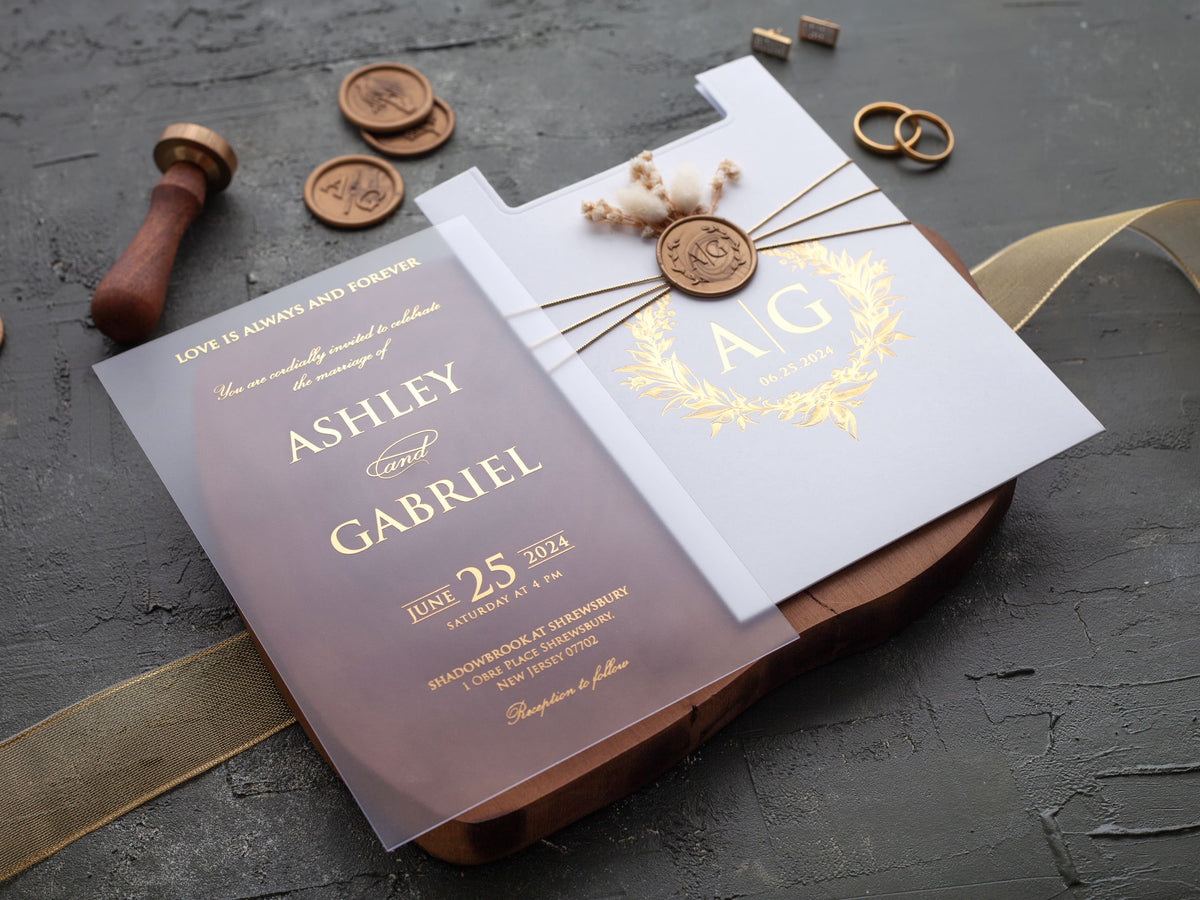 White and gold acrylic wedding invitation finished with a wax seal