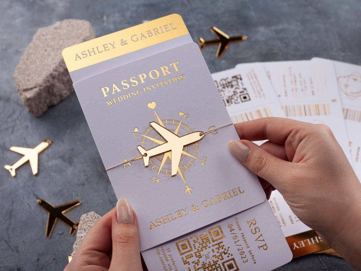 White passport wedding invitation with gold foil details