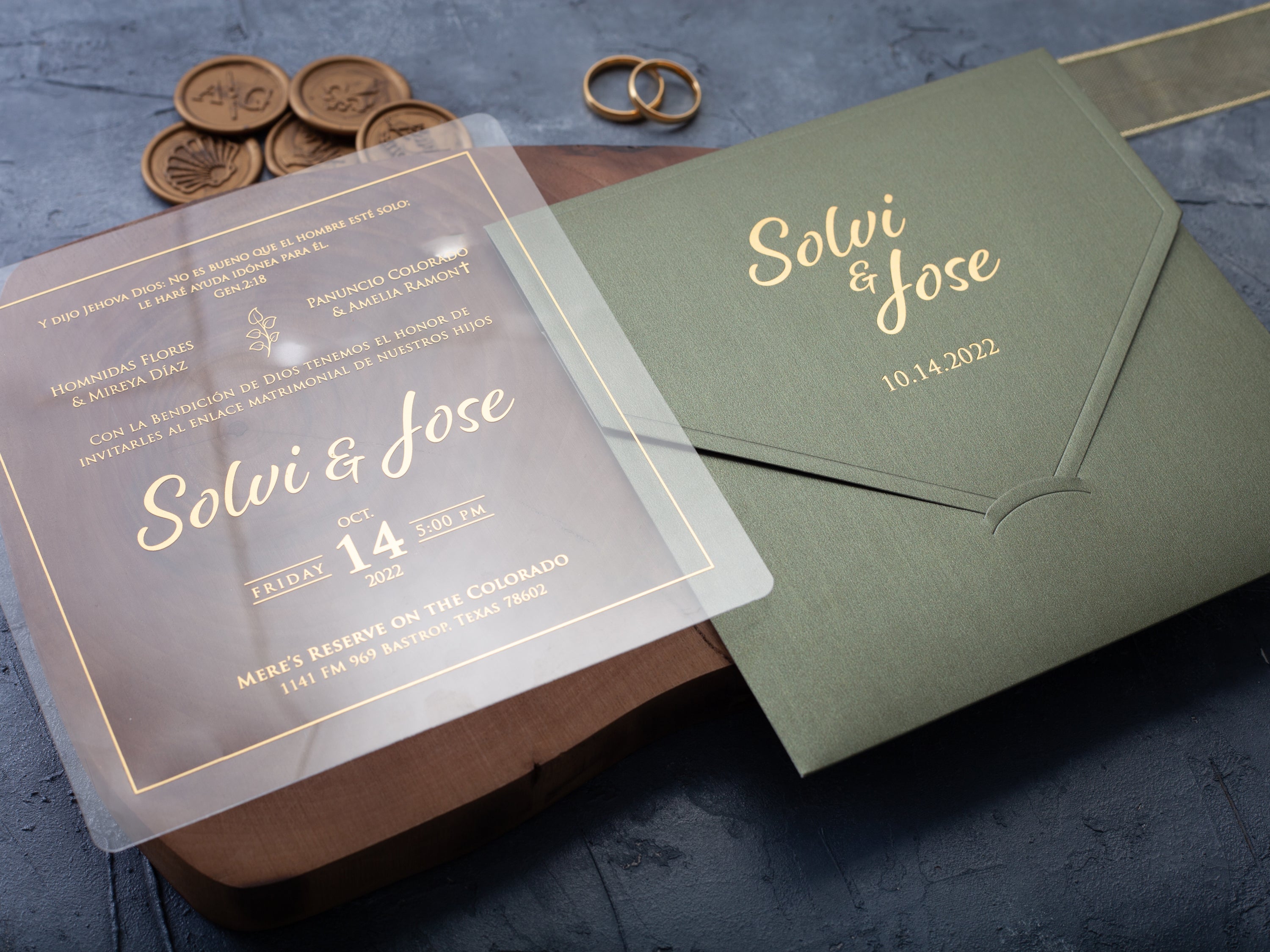 Clear acrylic wedding invitation with gold lettering and sage green envelope by World of Wedding Co.