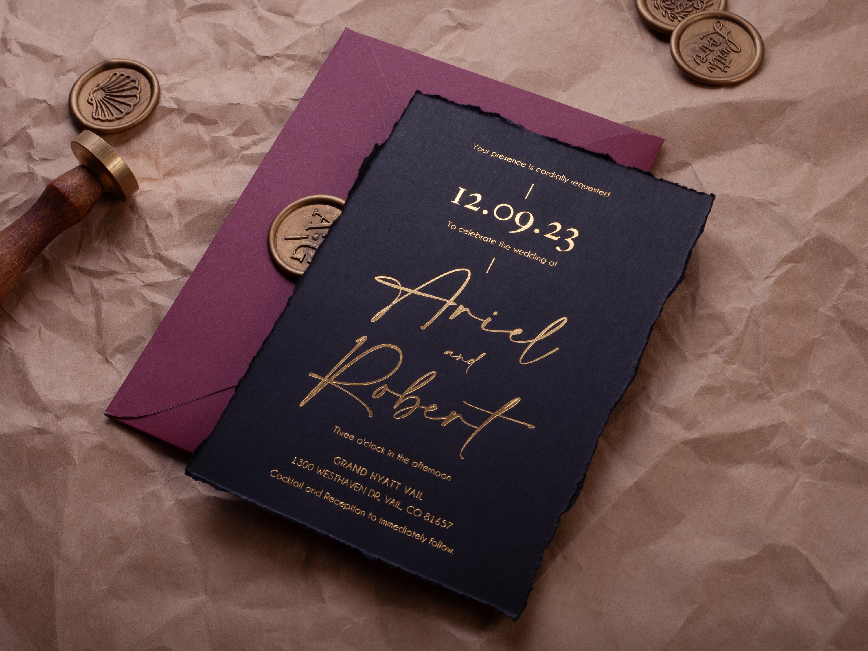 Black and gold deckle edge wedding invitation suite with wax seal, black ribbon, burgundy envelope, and QR RSVP card by World of Wedding Co.