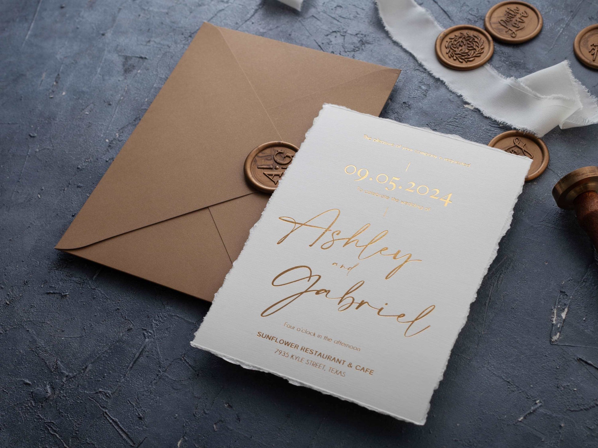 Deckled edge wedding invitation with gold foil details